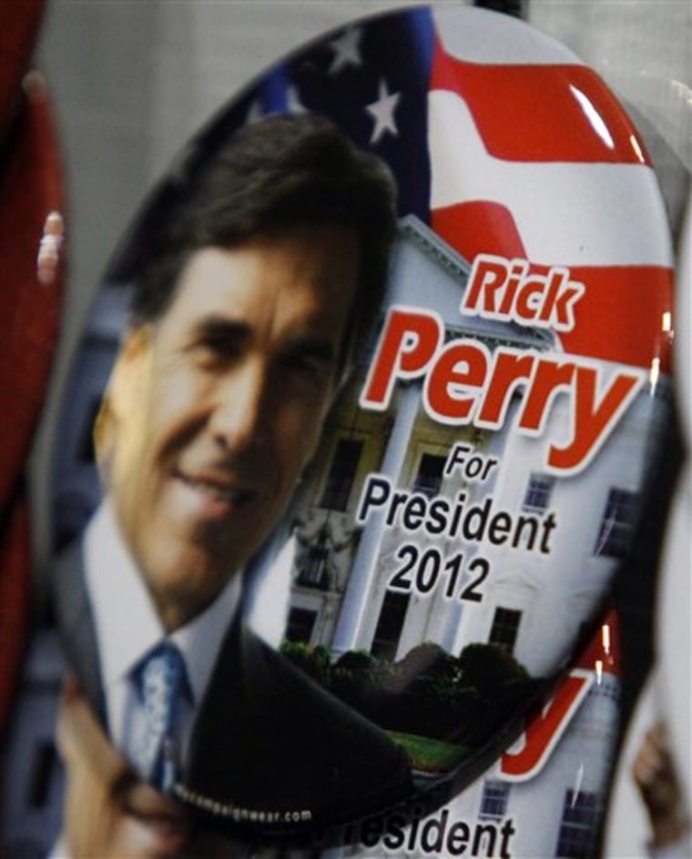 Rick Perry for President buttons are already appearing at the Republicans summer dinner where the Texas Governor is speaking in Birmingham, Ala.  The Texas governor is planning to enter the race for 2012 GOP presidential nomination Saturday with appearances in South Carolina and New Hampshire. (AP Photo/Butch Dill)